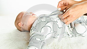 Baby kid cute child banner. Happy cute baby infant girl lying on white bed background. Light background. Little child
