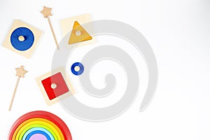 Baby kid toy background. Colorful wooden Montessori sensorial material learning educational toys on white background photo