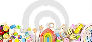 Baby kids toy banner background. Colorful educational toys on white background. Top view, flat lay, copy space for text photo