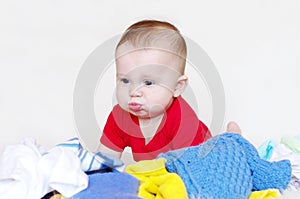 Baby among a kidswear