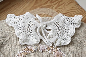 Baby knitted clothes. Handmade knitted clothes with embroidery