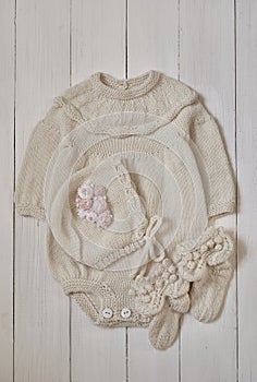 Baby knitted clothes. Handmade knitted clothes with embroidery