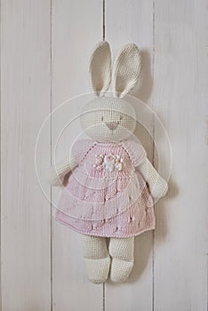 Baby knitted clothes and toys. Handmade knitted clothes with embroidery