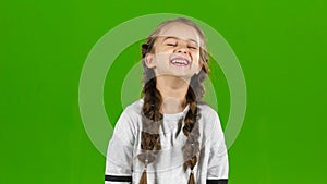 Baby laughs gaily. Green screen