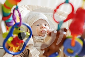 Baby laying in bouncer chair