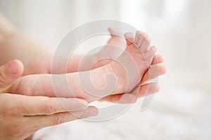 Baby legs in mother hands