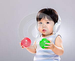 Baby listen to music and play ball