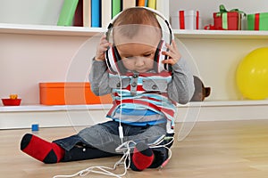 Baby listening to music with headphones