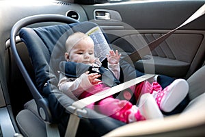 Baby little girl going for a safe drive