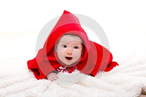 Baby Little Red Riding Hood on white fur