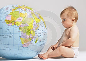 Baby Looking At Inflatable Globe