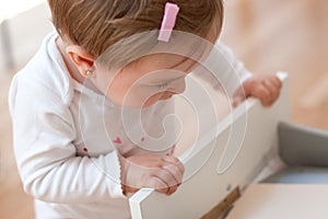 Baby looking inside a drawer