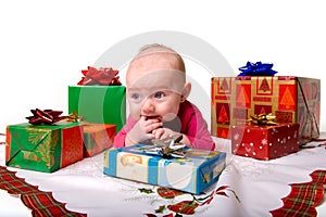 Baby Lying Amongst Christmas Gifts