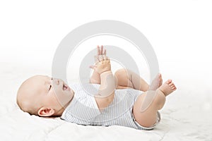 Baby Lying on Back, Happy Infant Kid in Blue Bodysuit, Beautiful