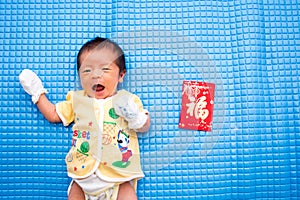 Baby Lying with Chinese Red Envelope