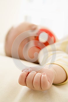 Baby lying indoors sleeping