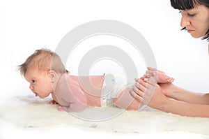 Baby massage. Ankles