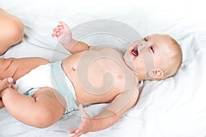 Baby massage. Mother massaging infant belly