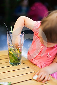 Baby messing up the lemonade photo