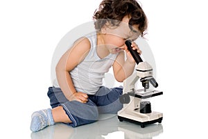 Baby with microscope.
