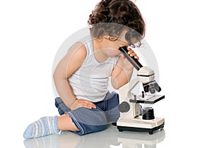 Baby with microscope.