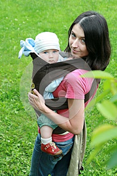 Baby with mom in baby carrier