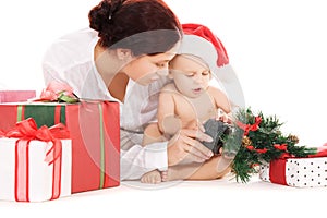 Baby and mother with christmas gifts