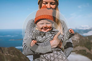 Baby with mother family travel lifestyle vacation woman hiking with infant child