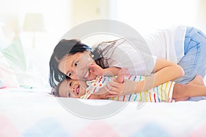 Baby and mother at home. Mom and child