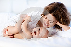 Baby and mother at home. Mom and child.