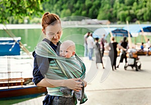 Baby and mother on nature photo