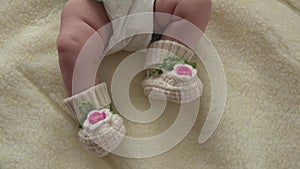 Baby Moves by Feet in Funny Socks. 4k Ultra HD