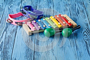 Baby musical instruments collection maracas, xylophone and tambourine