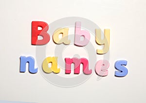Baby names spelt in magnet letters