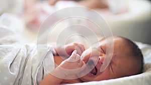 baby newborn crying. little baby a newborn crying of life lies in bed in the maternity hospital. happy family kid dream