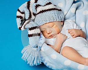 Baby newborn portrait, kid sleeping in blue hat