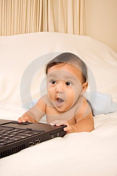 Baby with notebook portable computer