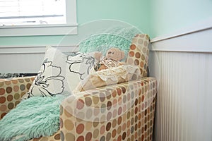 Baby nursery chair with blanket