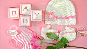 Baby nursery clothing and accessories overhead.