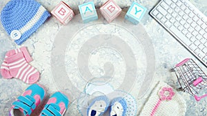 Baby nursery clothing bloggers desktop workspace blog header overhead flat lay.