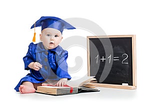 Baby with open book in academician clothes at