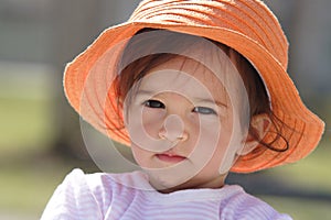 Baby with orange hat