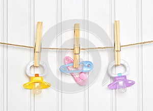 Baby Pacifier Binky Pink on a Clothesline