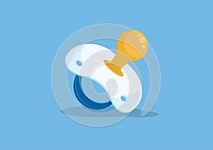 Baby pacifier on blue background.