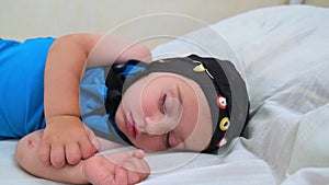 Baby patient sleeping in bed during EEG examination