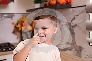 Baby picking nose. Little baby boy with finger in his nose. Cute little toddler boy picking his nose, close up