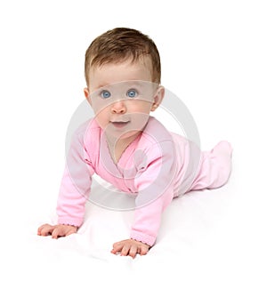 Baby in pink on white sheet