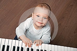Baby play black and white piano