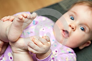 Baby play with toes