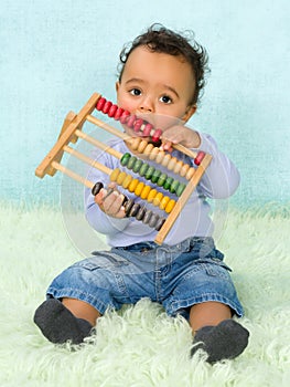 Baby playing with abacus